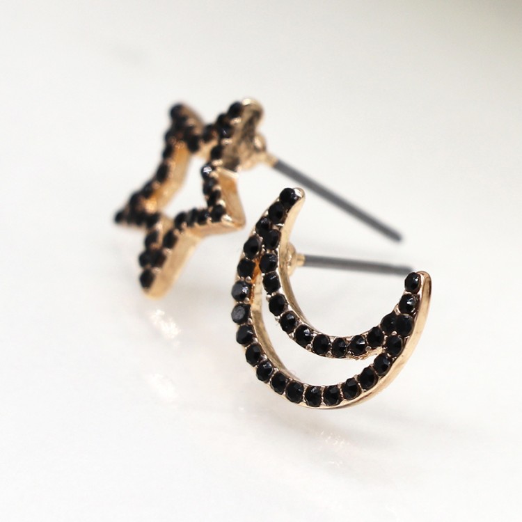 Faux gold mismatched star and crescent moon earrings with black crystals