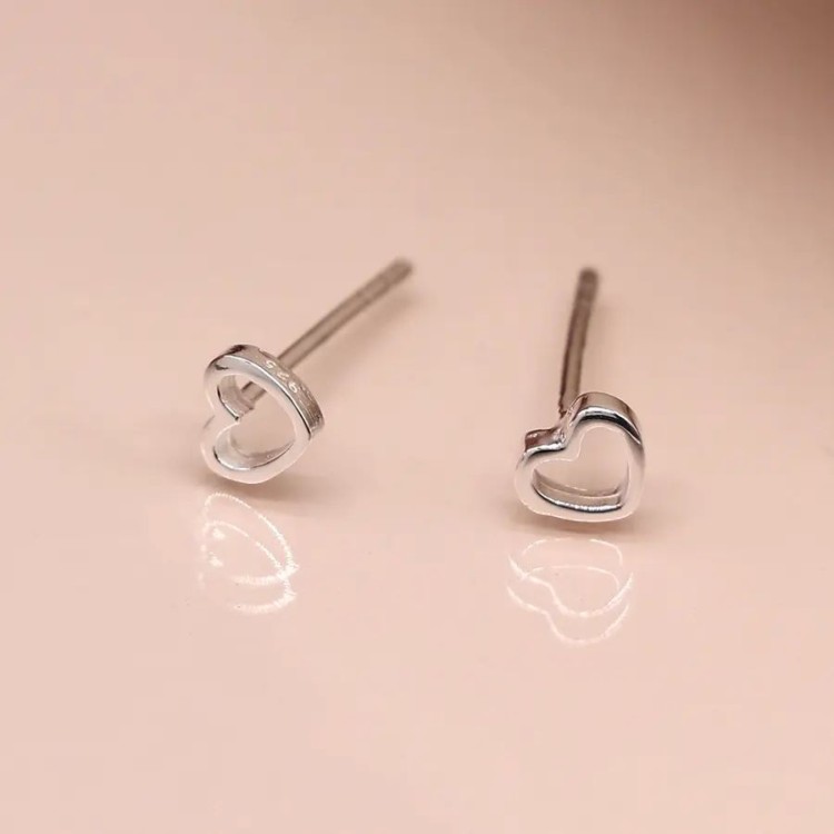 Tiny sterling silver cut out heart stud earrings